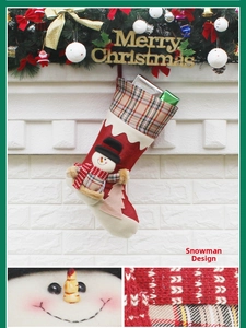 Detail of Christmas stocking featuring a 3D snowman figure with tartan plaid trim details