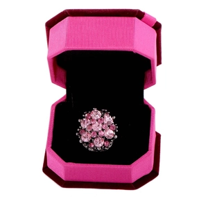 Pink crystal flower cluster ring presented in a matching textured pink jewelry gift box