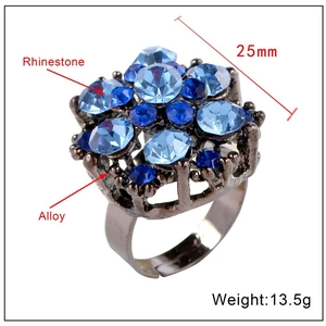Vintage cocktail ring with blue rhinestones on alloy base, 25mm diameter and 13.5g weight