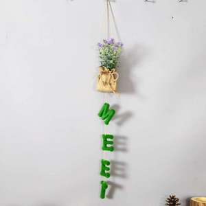 Close-up of hanging lavender bouquet in burlap bag with flocked MEET letters