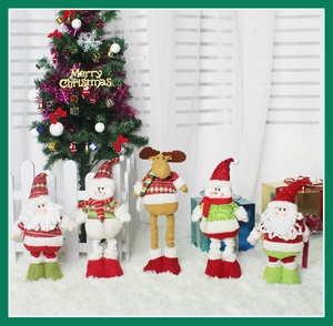 Detailed set of Christmas plush figurines featuring Santa, snowman and reindeer on white rug