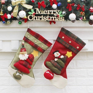 Premium burlap Christmas stockings set with Santa and Snowman hanging on a festive wall