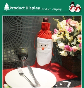 Detail showing Santa Claus wine bottle cover in red velvet with drawstring closure