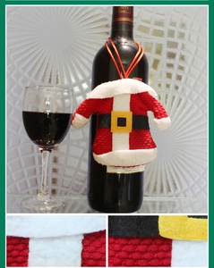 Detailed knit and felt textures of mini Santa Claus bottle cover decorations
