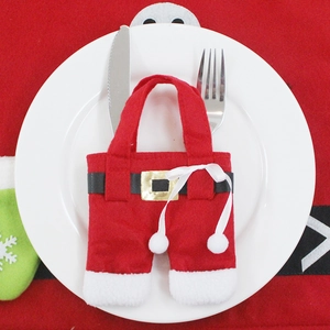 Christmas Santa pants cutlery holder set with stainless steel knife and fork on red background