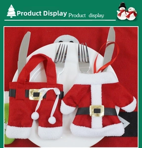 Detail of Santa jacket and trousers cutlery holders on a white plate with forks