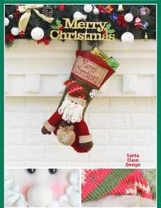 Detail view of large Santa Claus Christmas stocking with 3D doll and fireplace decor