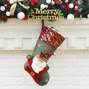 Classic green Christmas stocking with 3D Santa Claus and sparkly sequins for holiday decor