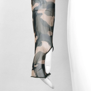 Detail of camouflage mesh sleeve featuring breathable fabric and thumb hole design