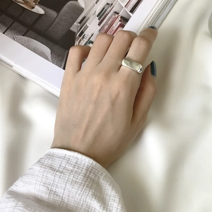 Close-up of S925 sterling silver vintage cross ring on a model hand with modern aesthetic