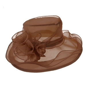 Detail view of brown organza sun hat featuring decorative mesh flowers and wide wavy brim