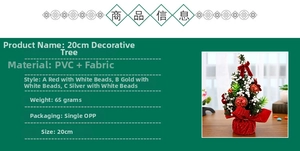 Detailed close-up of 20cm mini Christmas tree featuring red ornaments and snow effects