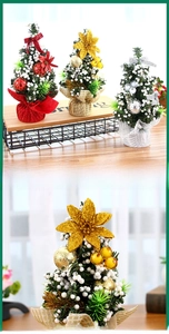 Close-up of three 20cm mini Christmas trees with colorful ornaments on a wooden table