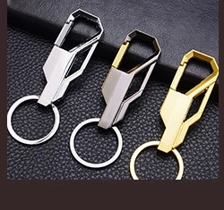 Three metal photo frame keychains in silver, gunmetal and gold on black leather