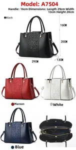 Detail view of stylish women's handbag in four colors with pearl pendant and detachable strap