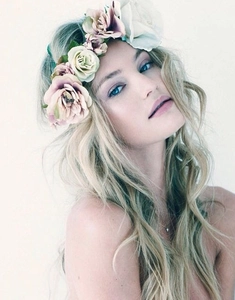 Detail of colorful bohemian flower crown with pink and beige floral hair accessories