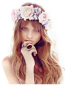Detail of pink and purple bohemian flower headband with a vintage red gemstone ring