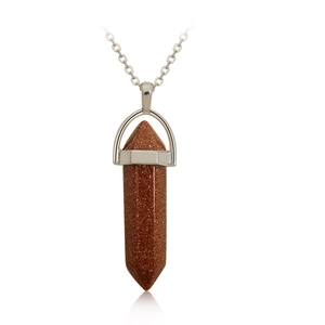 Macro view of a hexagonal aventurine stone pendant with silver metal chain and bail
