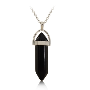 Macro shot of a black quartz point pendant with silver metal base and chain