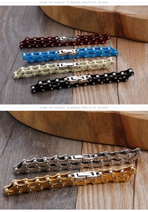 Macro shot of industrial steel bicycle link bracelets in red, blue, and black finishes