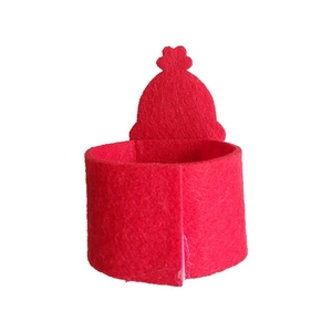 Macro shot of red felt Santa hat napkin ring for festive Christmas table decorations