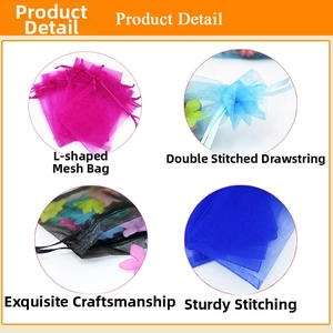 Detailed view of organza gift bags with gold snowflake pattern and drawstring closure