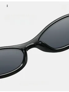 Detail view of comfortable integrated nose pads and streamlined hinges on black cat-eye sunglasses