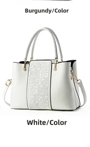 Close-up of white PU leather handbag featuring moire pattern and gold hardware details