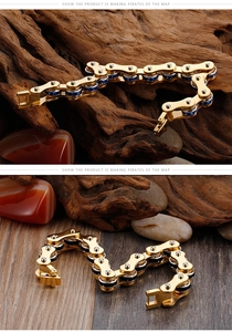 Detail of gold biker chain bracelets with blue and black accents on textured wood
