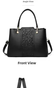 Front detail of black faux leather tote featuring cloud embroidery and pearl charms