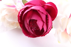 Macro detail of silk rose petals in vibrant rose and pale pink for bridal headbands