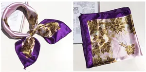 Detailed view of the 5019 silk scarf showing gold floral patterns on purple fabric
