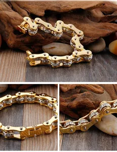 Macro detail of golden stainless steel bike chain bracelet with double row cubic zirconia