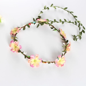 Floral bridal wreath with pink and yellow artificial flowers for beach wedding hairstyle