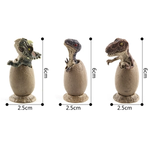 Miniature Jurassic dinosaur egg hatching models of Triceratops and T-Rex with base