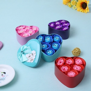 Detail of heart-shaped soap rose gift box with 6 roses and a delicate bow decoration