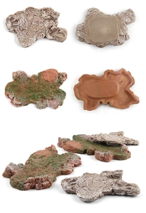 Macro detail of artificial rock landscape base with realistic stone texture and moss