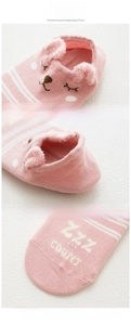 Close-up of pink striped cotton socks with 3D bear ears and reinforced seamless toe