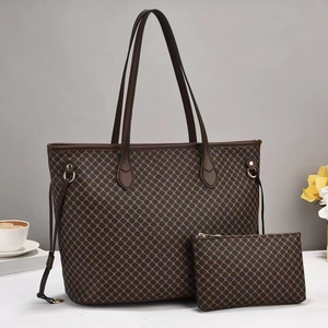Women's two-piece tote bag set with deep brown geometric pattern and matching clutch pouch