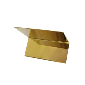 Detail of the high-gloss gold metal bag display stand with a geometric folded design
