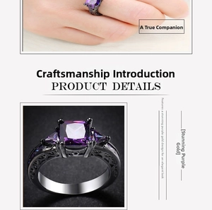 Detail view of gothic black gold plated ring with purple zircon and intricate carvings