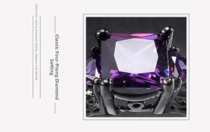 Detailed macro view of large square purple zircon set in black gold four-prong ring