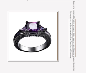 Detailed side view of black gold ring with purple square zircon and hollow patterns