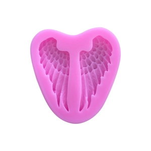 Pink heart-shaped silicone mold with detailed angel wings pattern for baking and soap