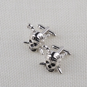 Polished silver skull cufflinks with pirate design and swivel bar closure for men