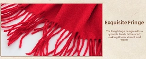 Detailed view of the red wool shawl featuring soft knit textures and long fringed edges