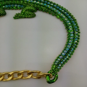 Vintage green crocodile necklace with blue rhinestones and gold-tone chain for women