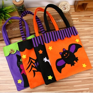 Detail of Halloween felt candy bags featuring black cat, spider, and bat cartoon designs