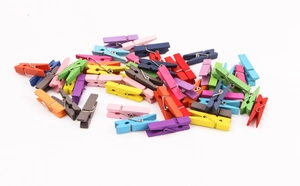 Assorted colorful mini wooden clothespins for photo hanging and home decoration