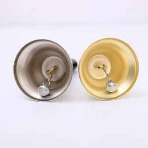 Traditional metal Santa hand bells in gold and silver finish with internal clapper